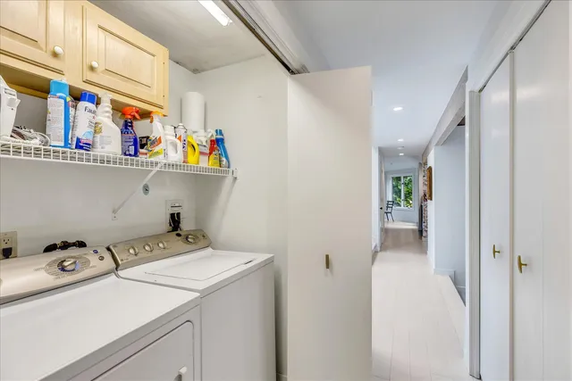 a view of storage and utility room with washer and dryer