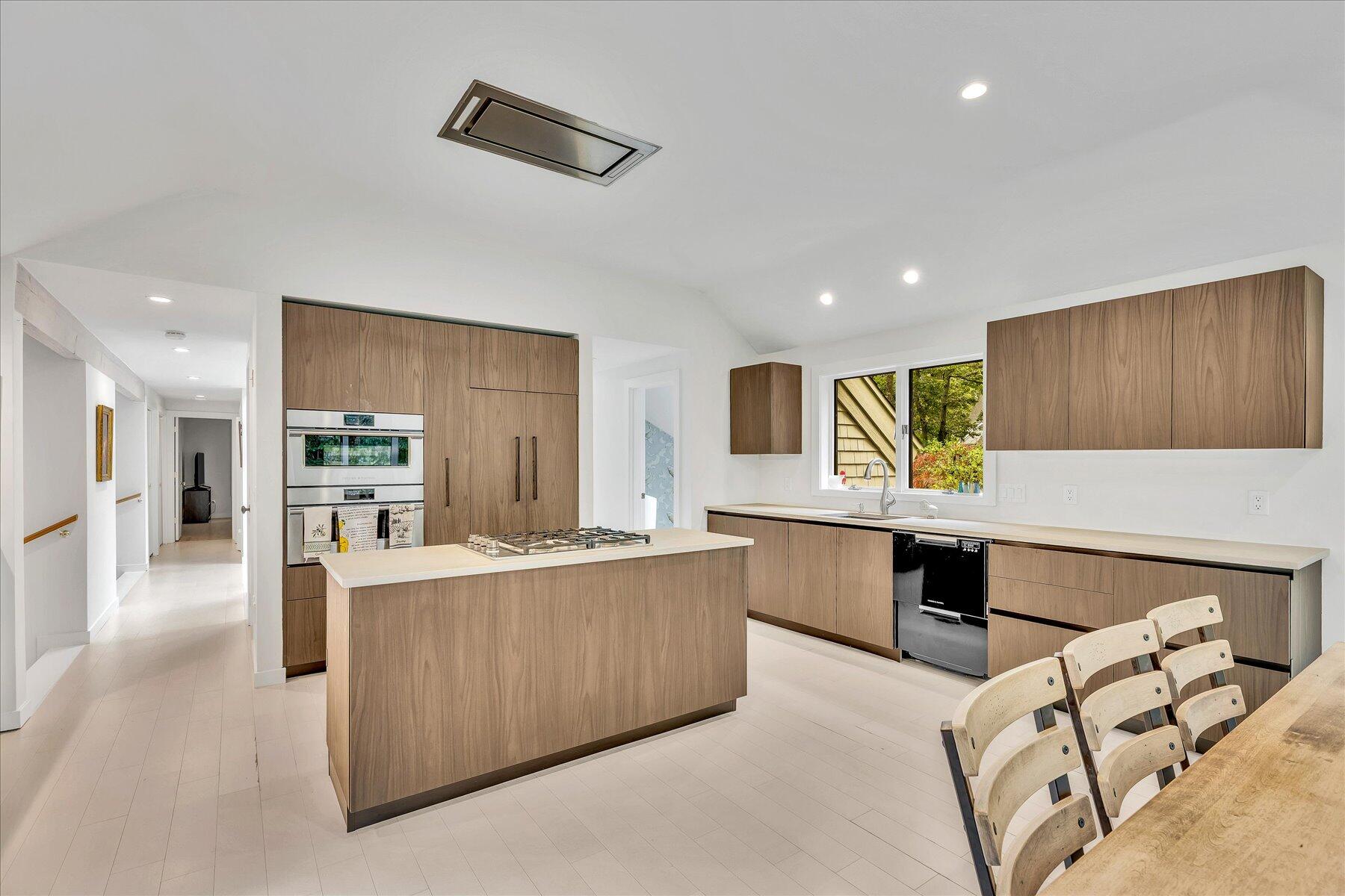 50 Topping Lift Mashpee, MA 02649 - Photo 6 of 32 a large kitchen with stainless steel appliances kitchen island granite countertop a refrigerator and a stove top oven