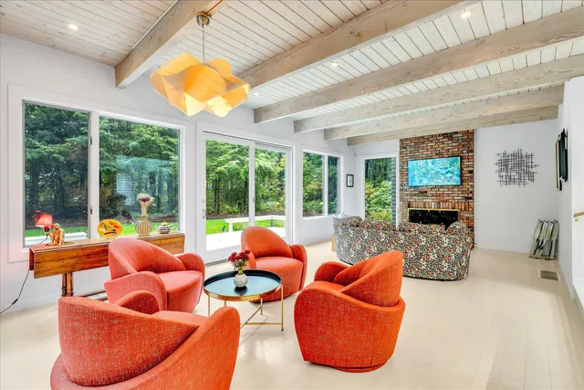 a room with furniture and a large window