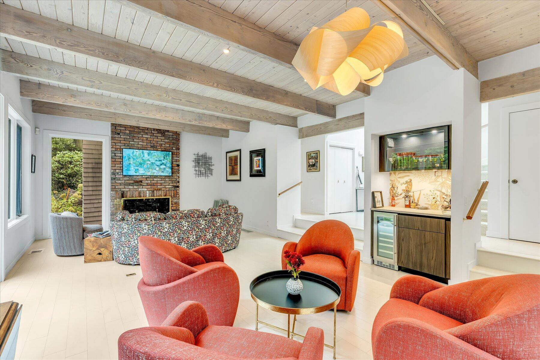 50 Topping Lift Mashpee, MA 02649 - Photo 10 of 32 a living room with furniture a flat screen tv and a large window