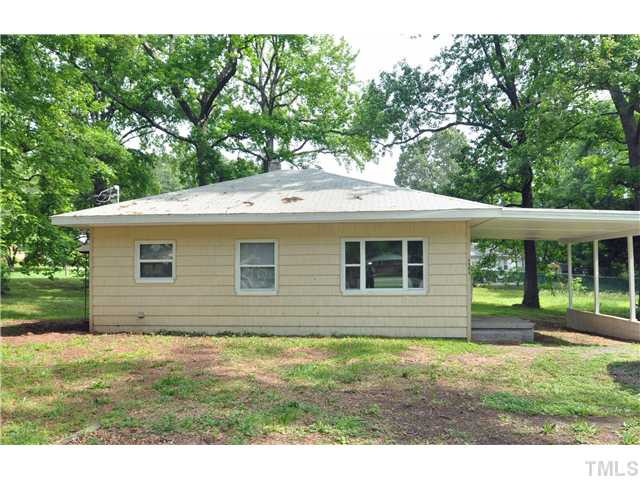 1705 Cheek Road Durham, NC 27704 - Photo 1 of 25 a backyard of a house with lots of green space