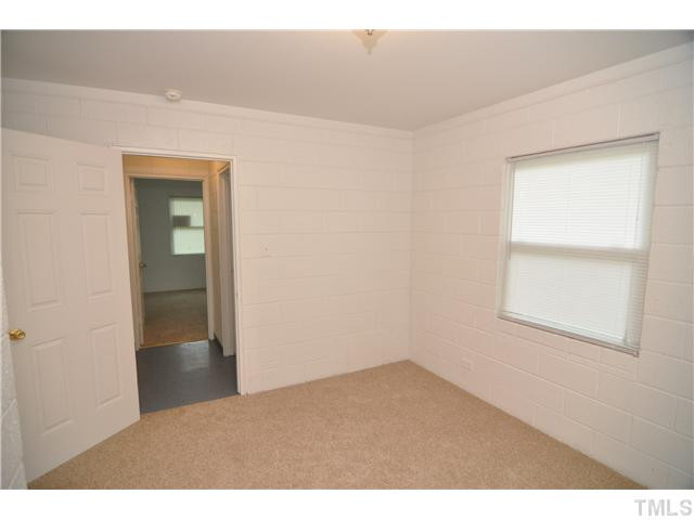 1705 Cheek Road Durham, NC 27704 - Photo 19 of 25 view of an empty room and window