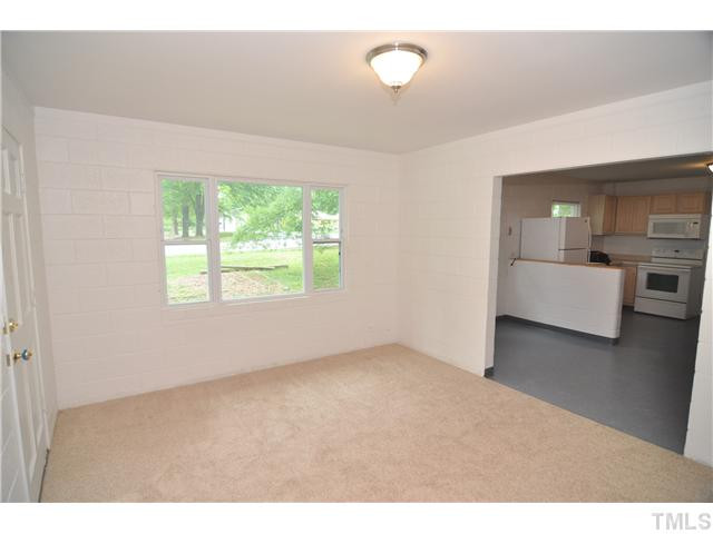1705 Cheek Road Durham, NC 27704 - Photo 4 of 25 a view of a bedroom with furniture and window