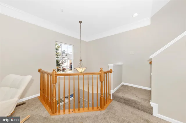 a view of hallway with furniture