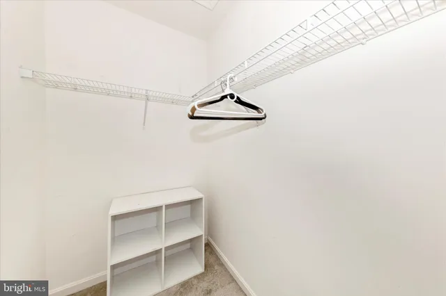 a view of an empty walk in closet