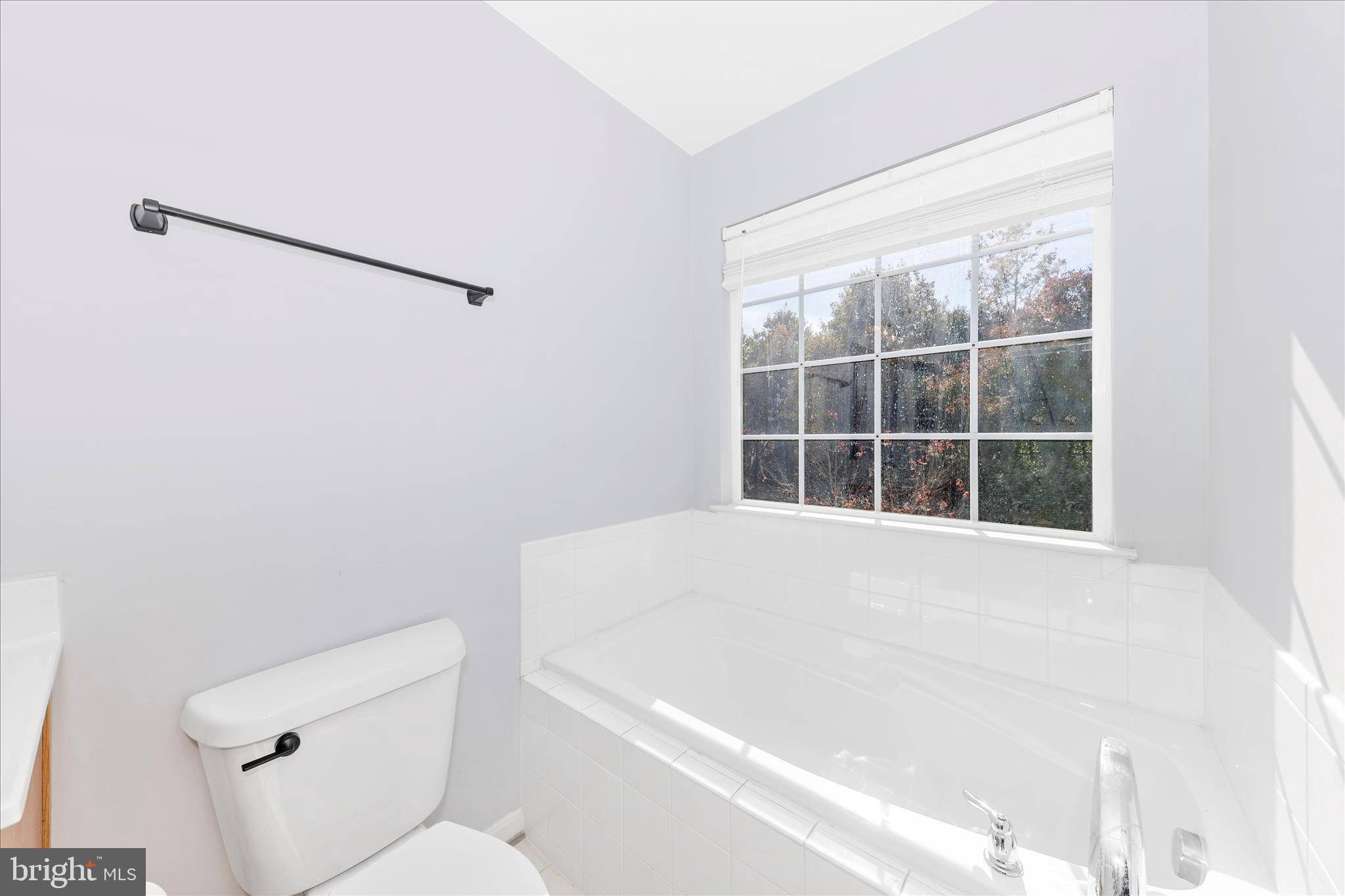 1812 Reading Court Mount Airy, MD 21771 - Photo 27 of 43 a bathroom with a bathtub and window