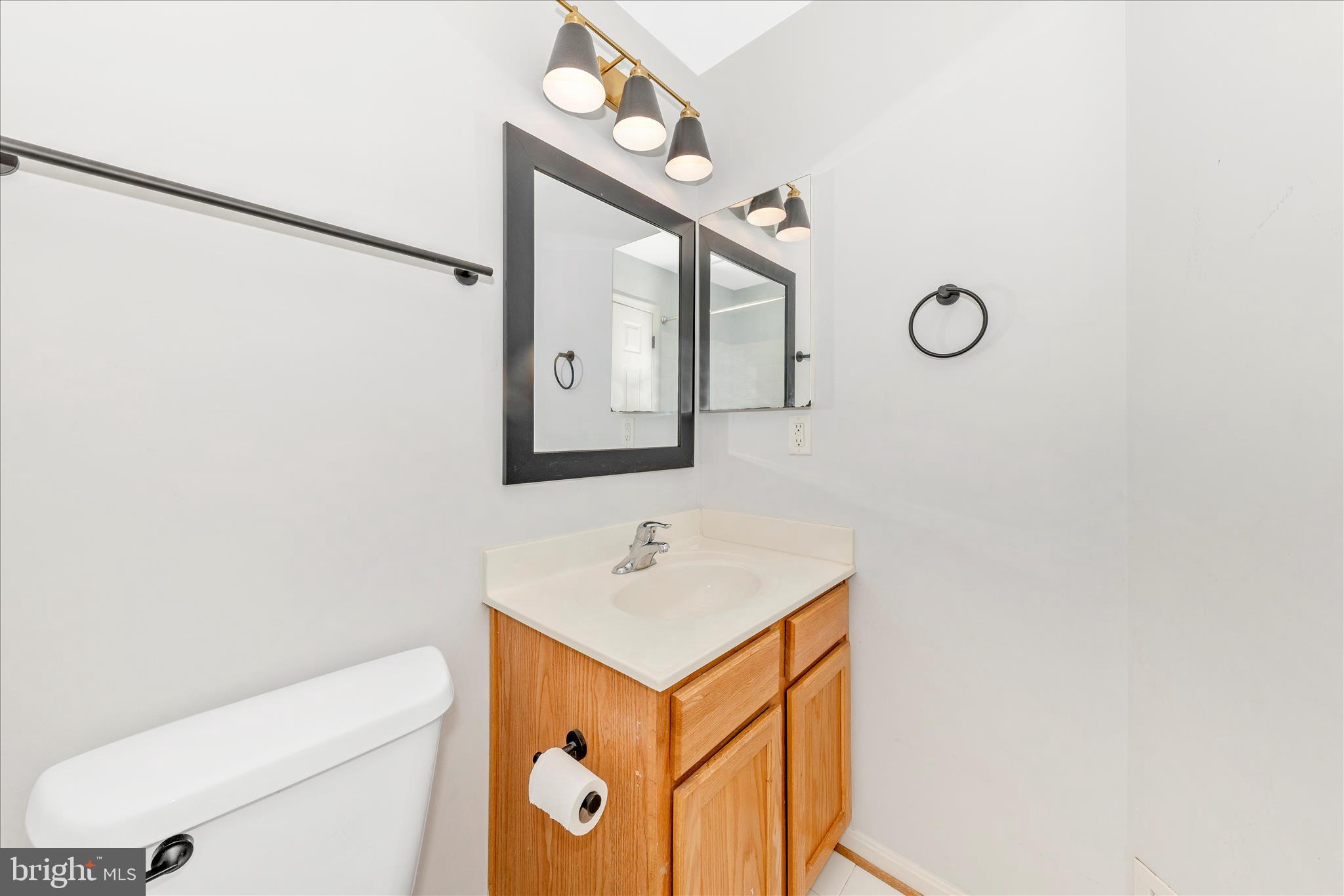 1812 Reading Court Mount Airy, MD 21771 - Photo 33 of 43 a bathroom with a toilet sink vanity and mirror