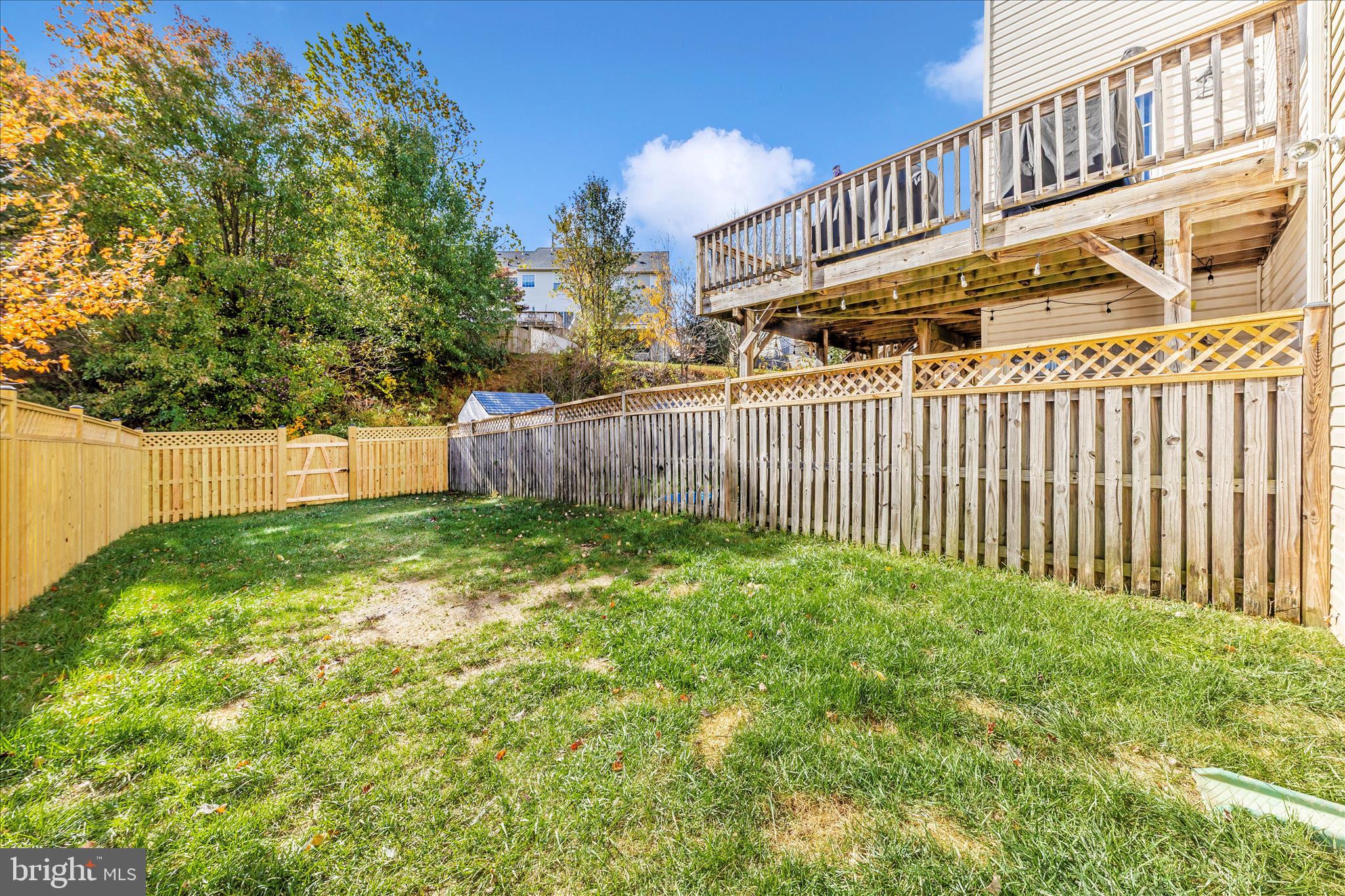 1812 Reading Court Mount Airy, MD 21771 - Photo 38 of 43 a backyard of a house with a garden and deck