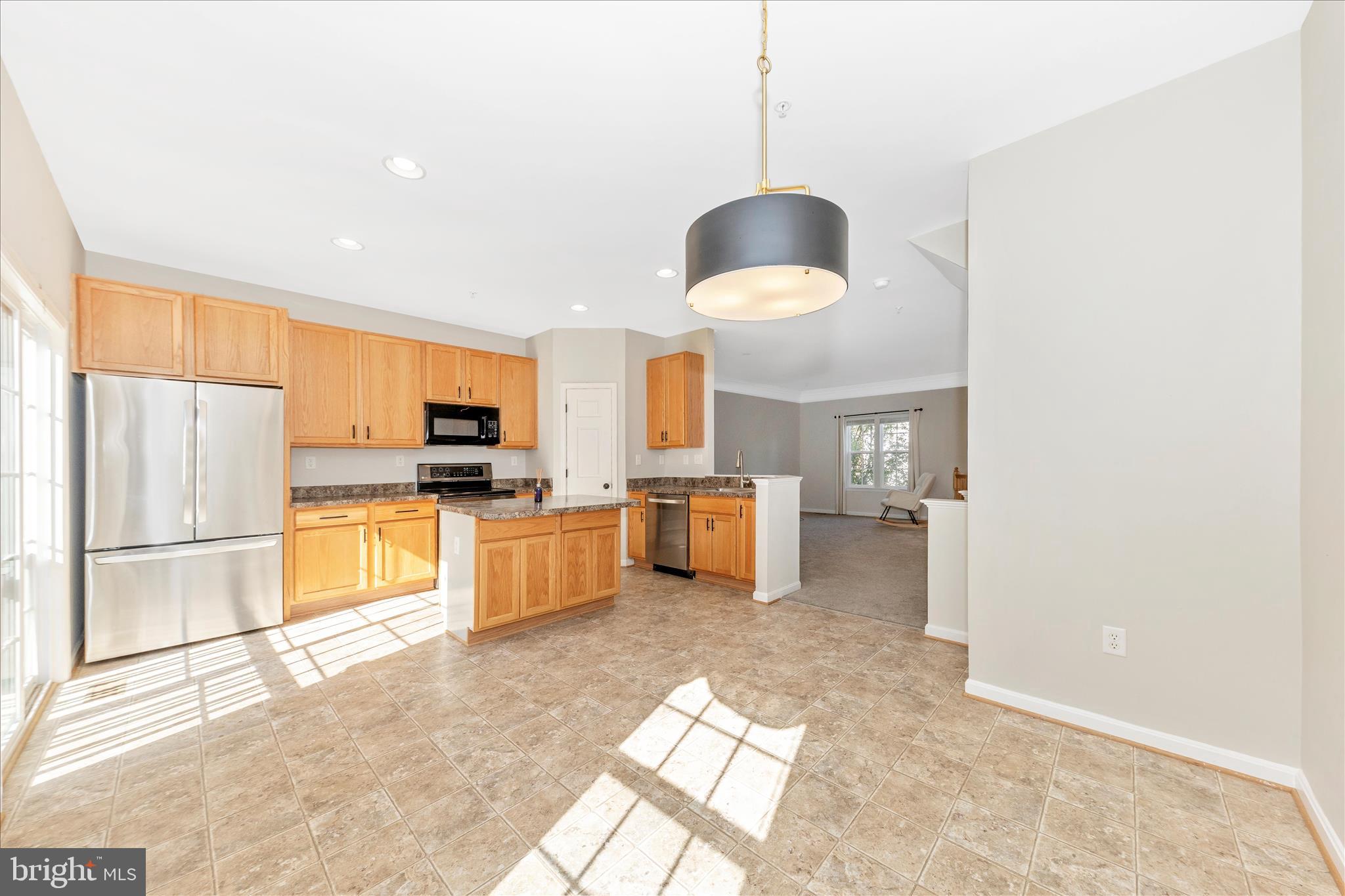 1812 Reading Court Mount Airy, MD 21771 - Photo 9 of 43 a kitchen with stainless steel appliances a stove a refrigerator and a sink