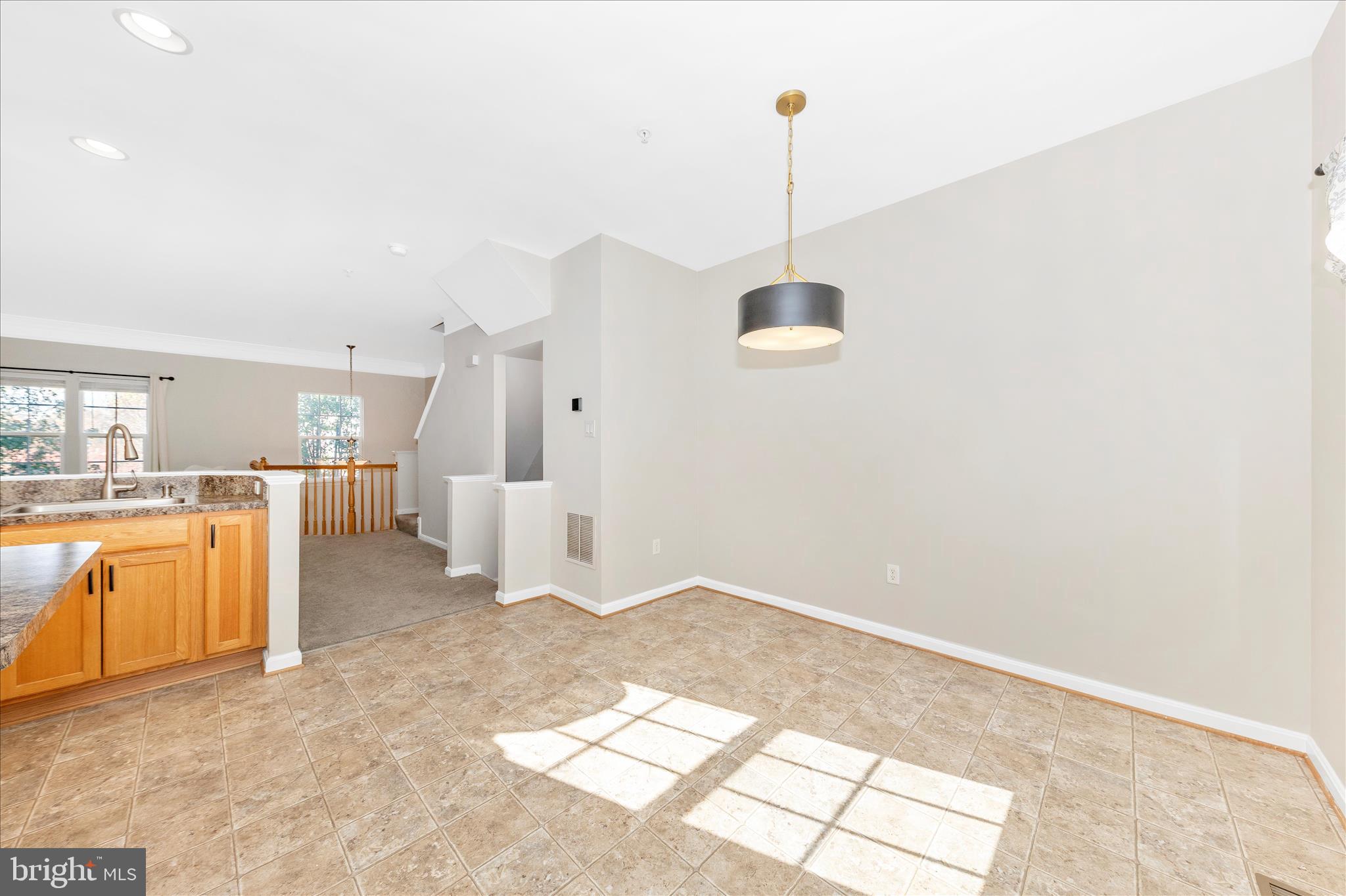 1812 Reading Court Mount Airy, MD 21771 - Photo 10 of 43 a view of empty room with kitchen view