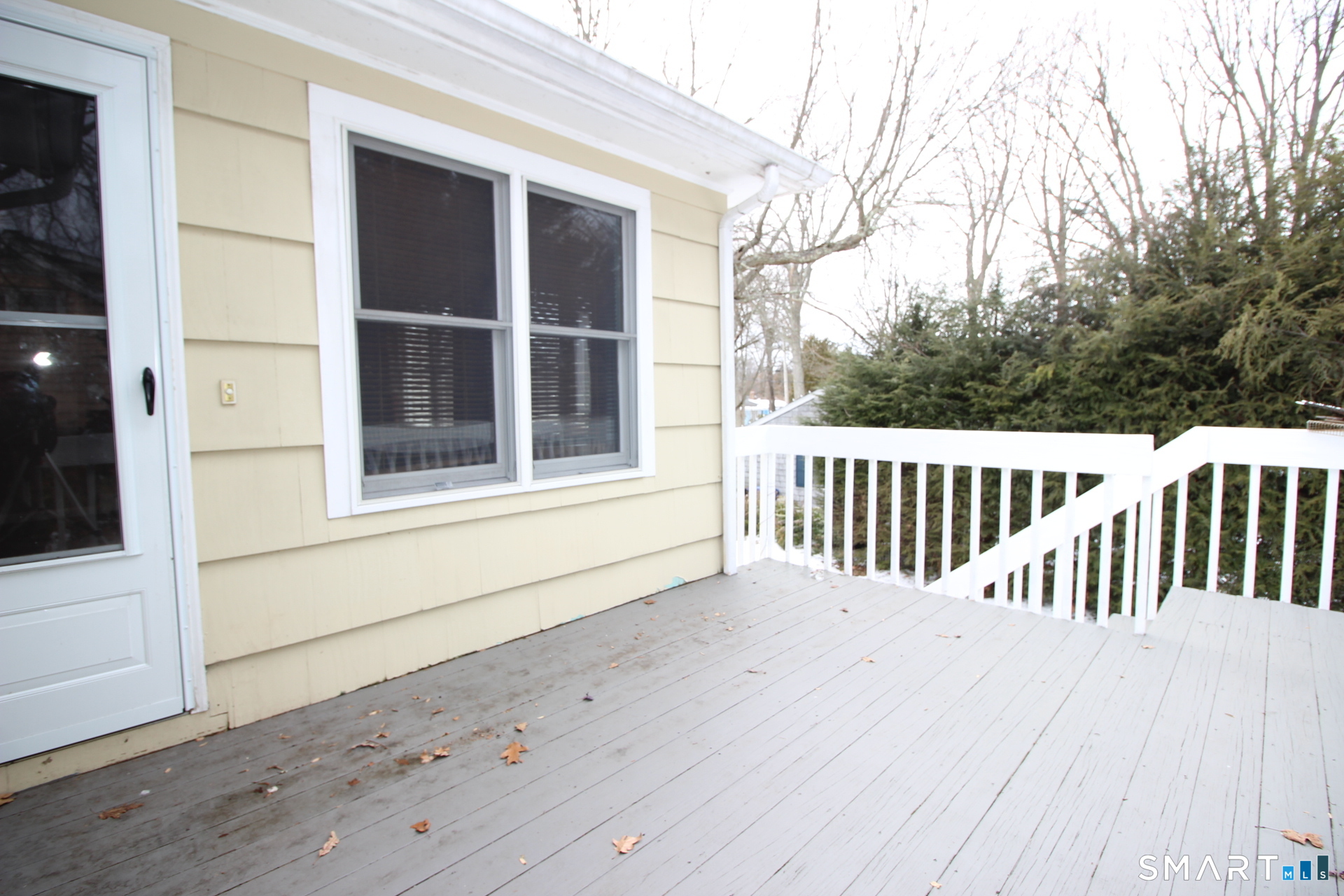 76 Elliott Road Trumbull, CT 06611 - Photo 21 of 26 a view of a house with a wooden fence