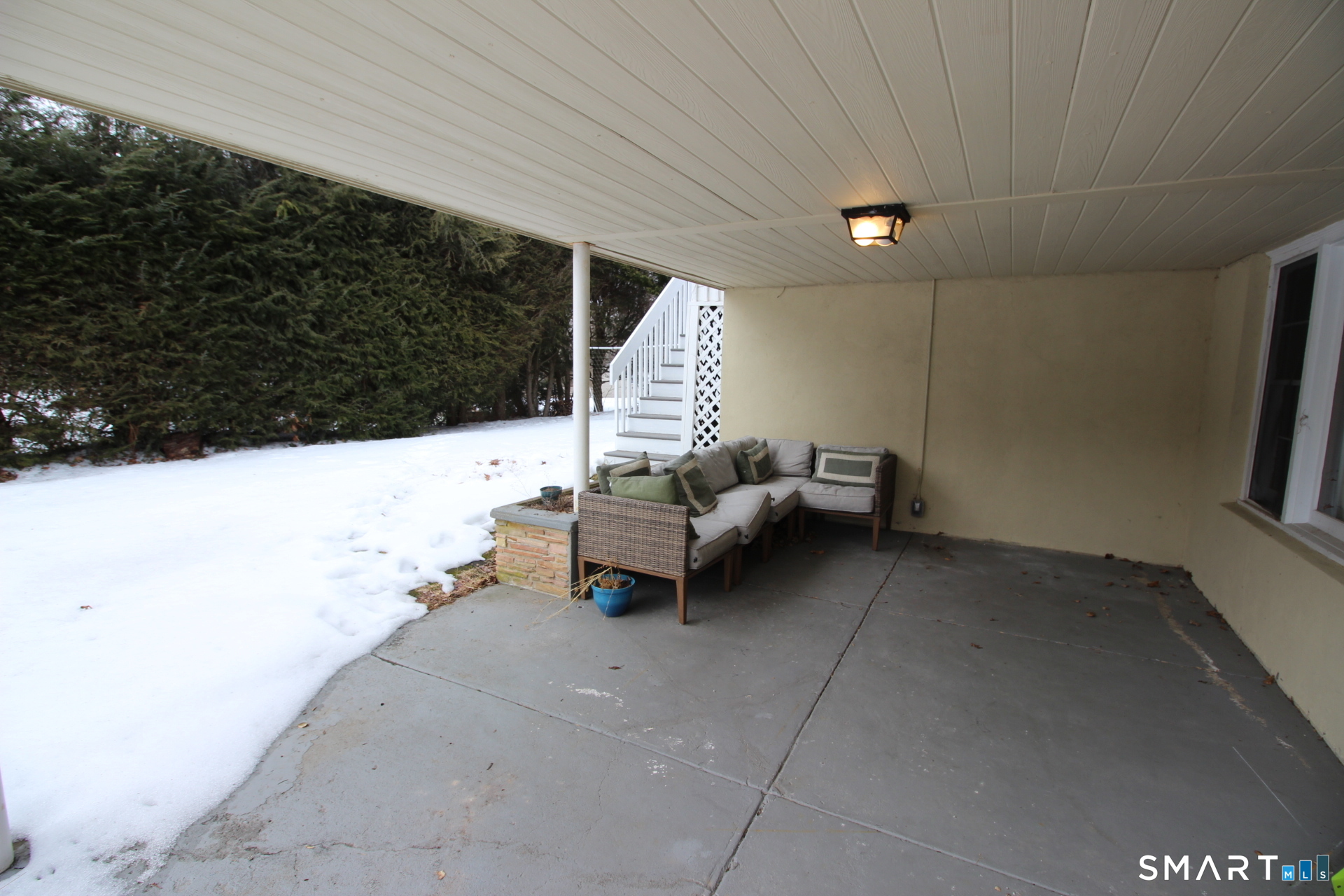 76 Elliott Road Trumbull, CT 06611 - Photo 22 of 26 a view of a patio with table and chairs