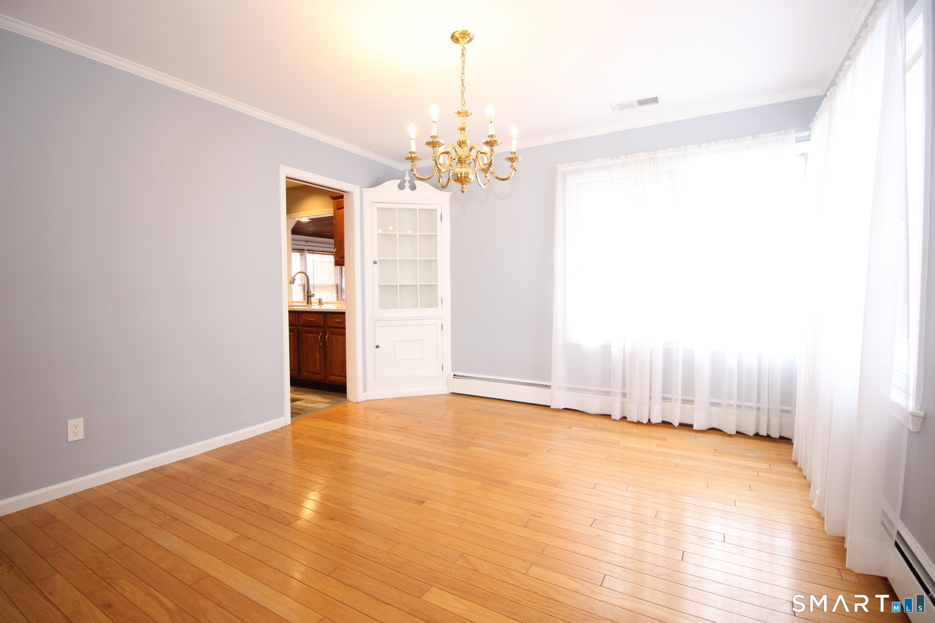 76 Elliott Road Trumbull, CT 06611 - Photo 4 of 26 a view of an empty room with chandelier