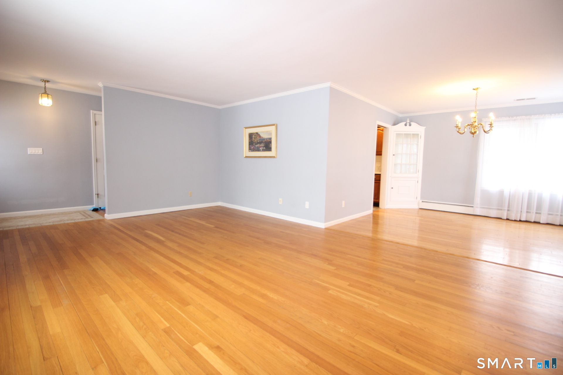 76 Elliott Road Trumbull, CT 06611 - Photo 5 of 26 a view of empty room with wooden floor