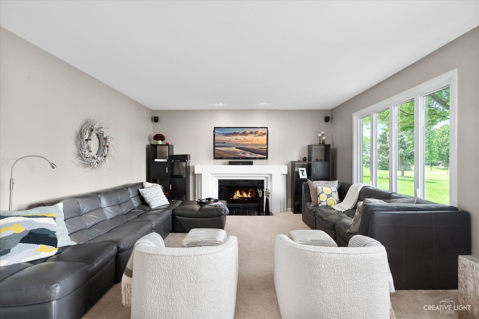 2635 High Meadow Road Naperville, IL 60564 - Photo 13 of 38 a living room with furniture a fireplace and a large window