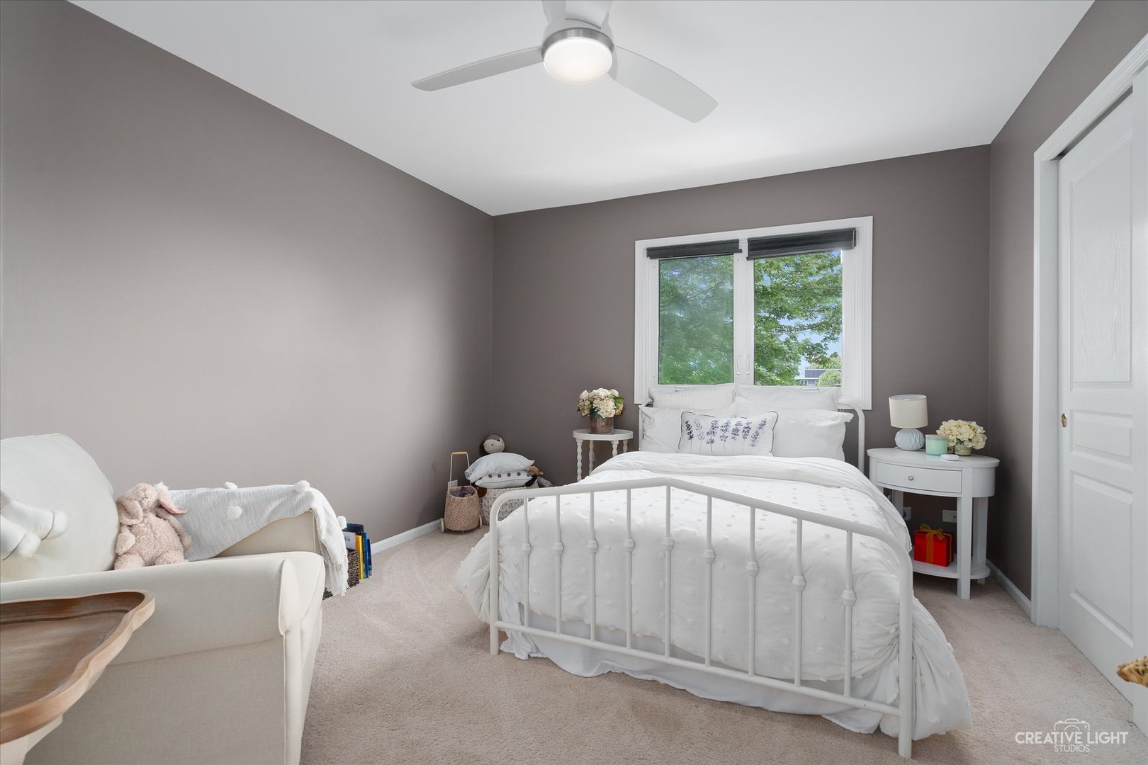 2635 High Meadow Road Naperville, IL 60564 - Photo 23 of 38 a bedroom with a bed and a chandelier