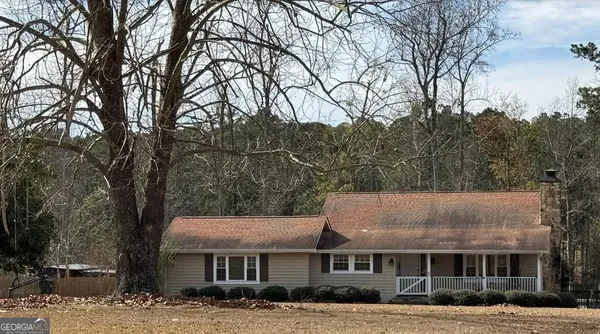 a view of house with a outdoor space