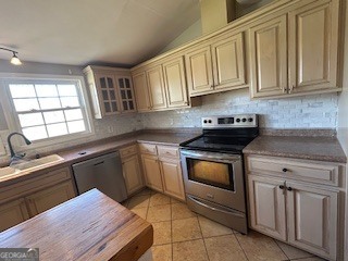 218 Hidden Springs Road Climax, GA 39834 - Photo 17 of 35 a kitchen with stainless steel appliances granite countertop a sink stove and cabinets