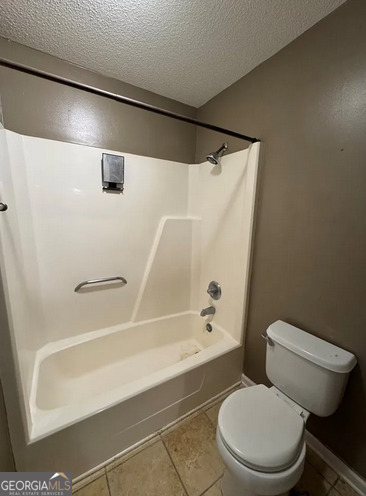 218 Hidden Springs Road Climax, GA 39834 - Photo 23 of 35 a bathroom with a toilet and a bath tub