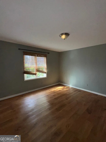 218 Hidden Springs Road Climax, GA 39834 - Photo 24 of 35 a view of an empty room with wooden floor and a window