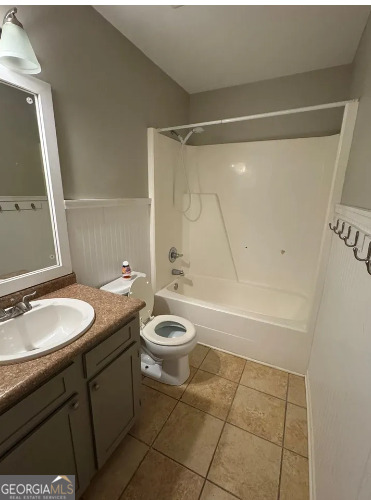 218 Hidden Springs Road Climax, GA 39834 - Photo 26 of 35 a bathroom with a granite countertop sink toilet a mirror and shower