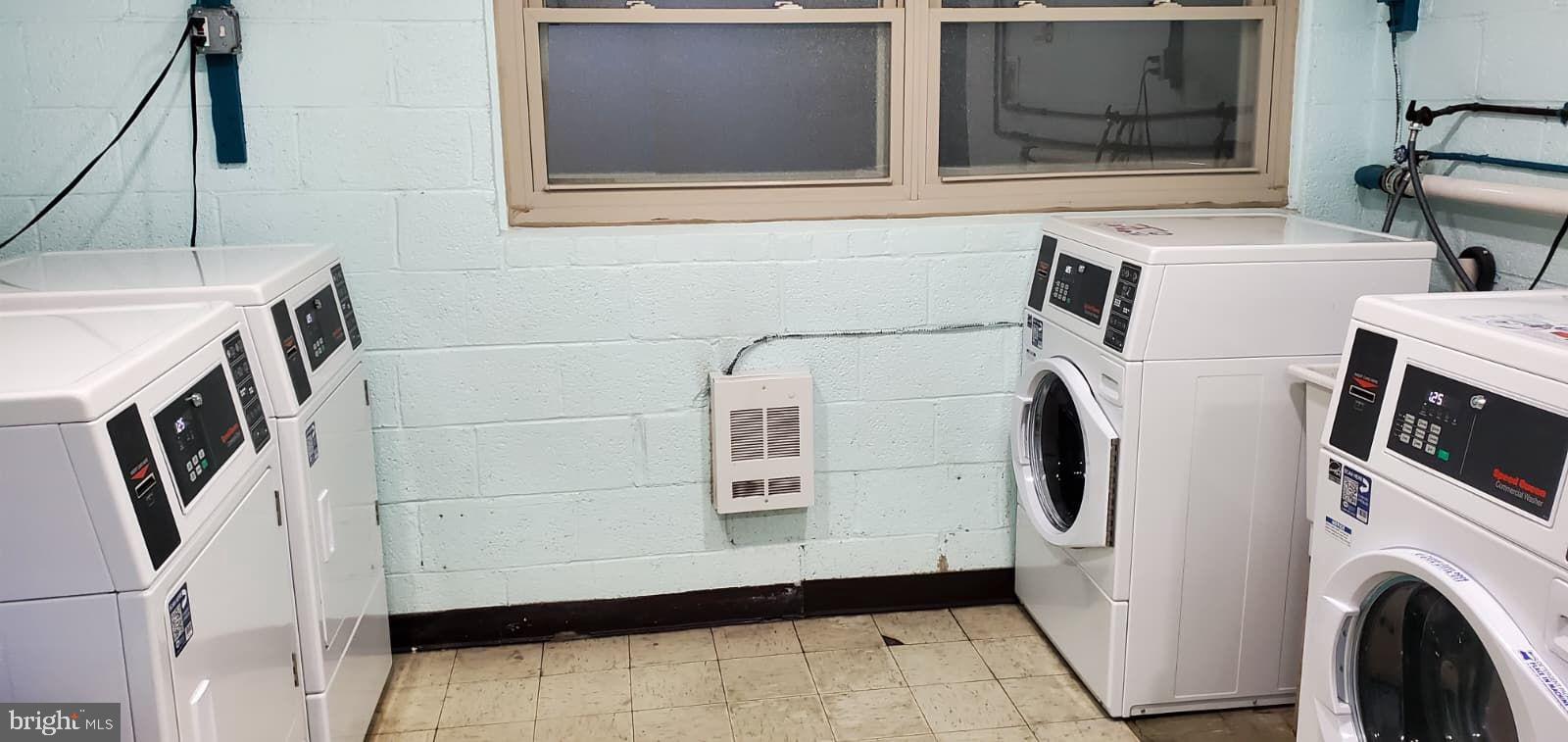2305 Greenery Lane, Unit 1023 Silver Spring, MD 20906 - Photo 13 of 23 a utility room with dryer and washer