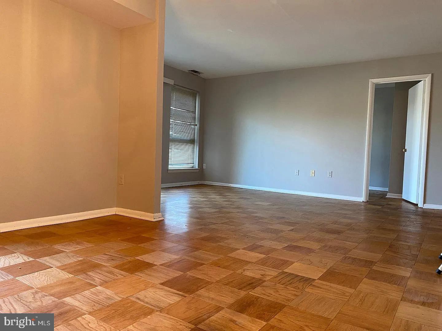 2305 Greenery Lane, Unit 1023 Silver Spring, MD 20906 - Photo 5 of 23 a view of an empty room and window