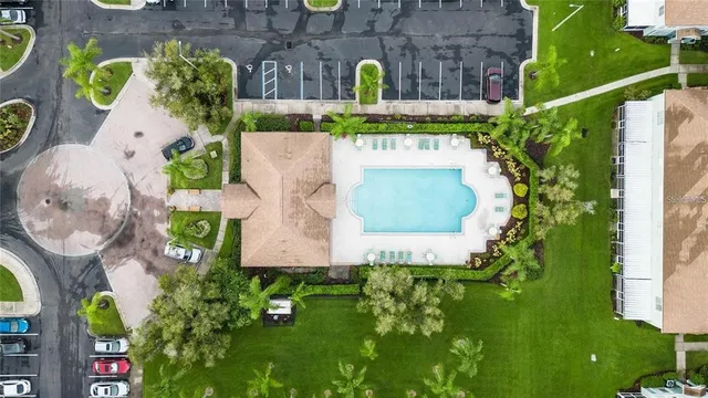 an aerial view of residential house with outdoor space and swimming pool