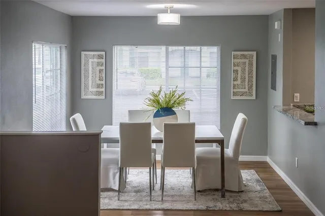 a view of a dining room with furniture and window