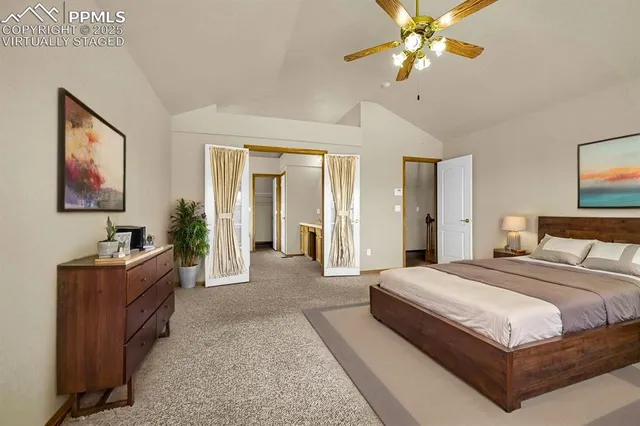 a bedroom with a bed dresser and window