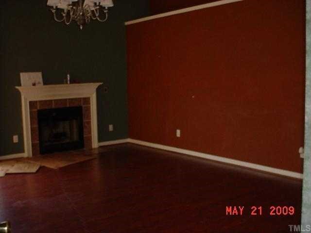 5020 Mocha Lane Raleigh, NC 27616 - Photo 2 of 4 a view of an empty room with a fireplace