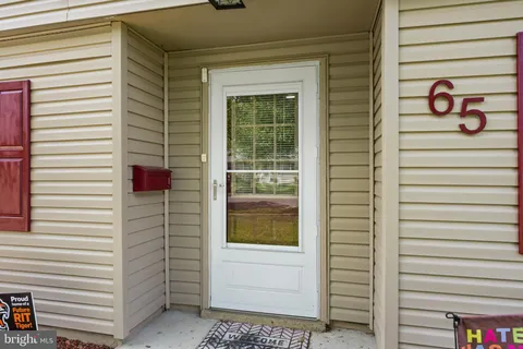 a view of a door and a window