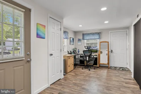 a view of a kitchen with furniture and a window