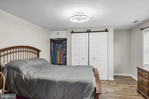 a bedroom with a bed and a table