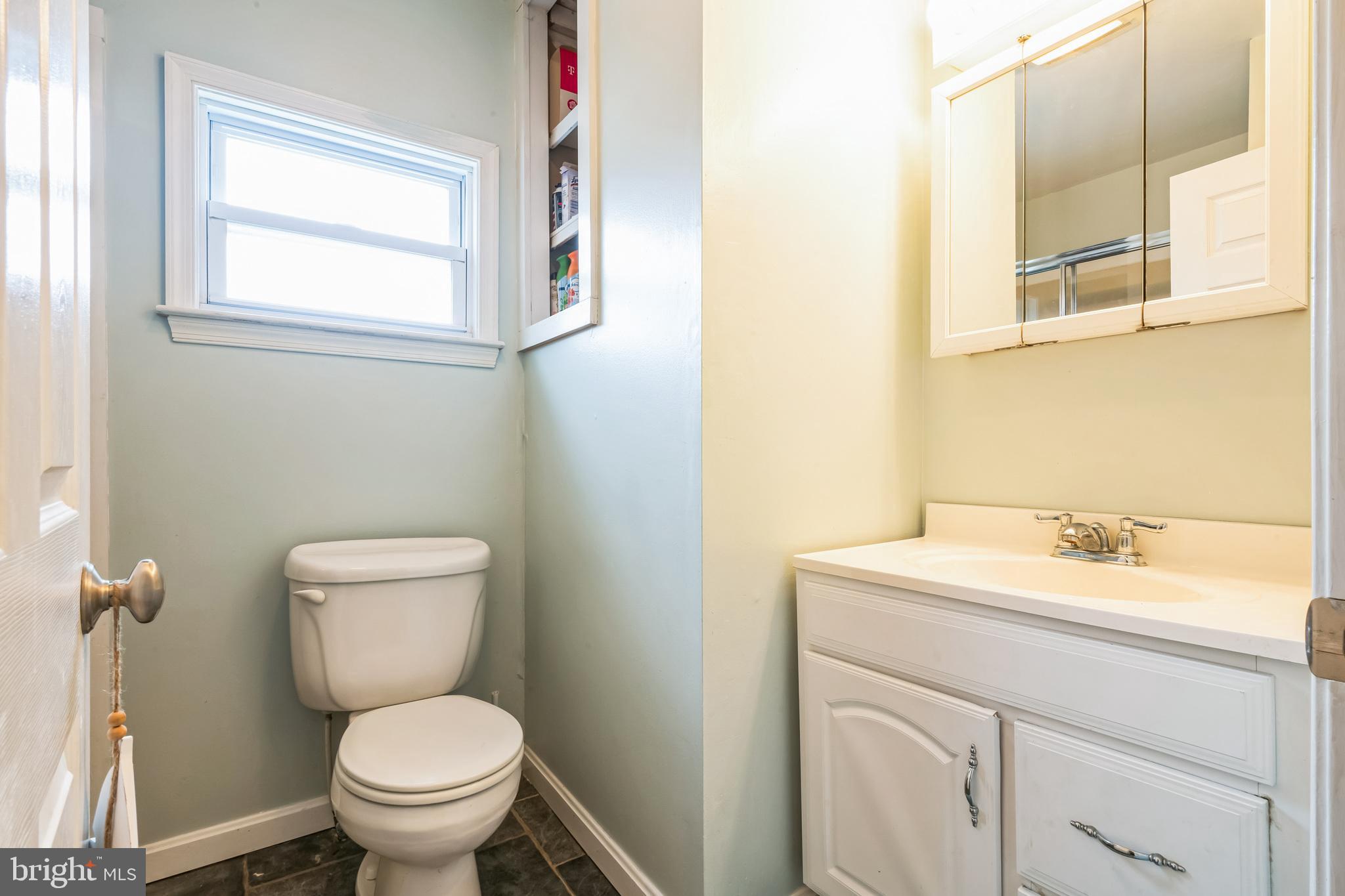 13 Paula Lane Villas, NJ 08251 - Photo 16 of 30 a bathroom with a toilet sink vanity and mirror