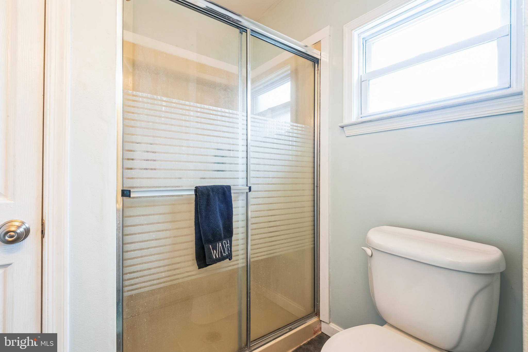 13 Paula Lane Villas, NJ 08251 - Photo 17 of 30 a bathroom with a toilet and a shower curtain