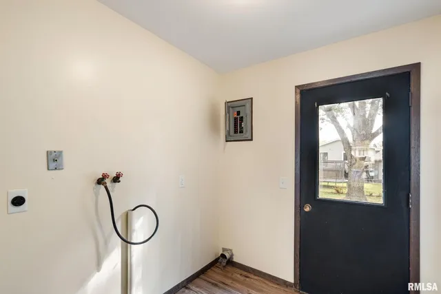 a bathroom with a toilet a sink and a window