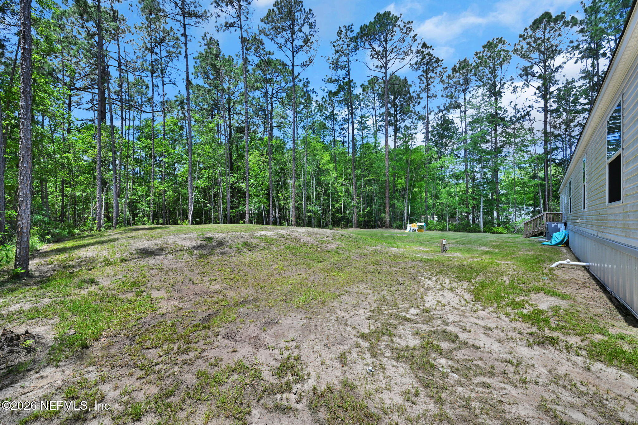540783 Lem Turner Road Callahan, FL 32011 - Photo 36 of 36 a view of a field with trees in the background