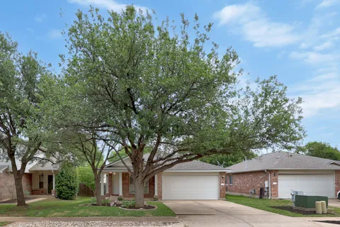 front view of a house with a trees