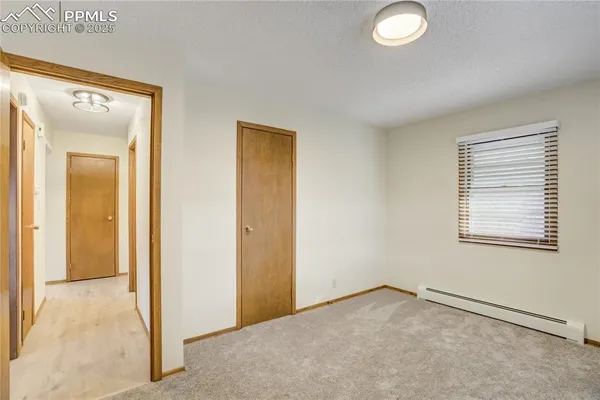 a view of an empty room and window