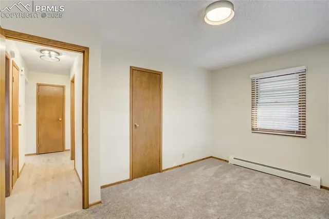 a view of an empty room and window