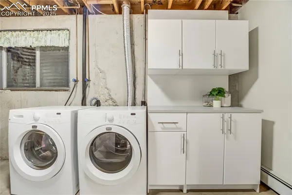 a view of a storage & utility room with washer and dryer