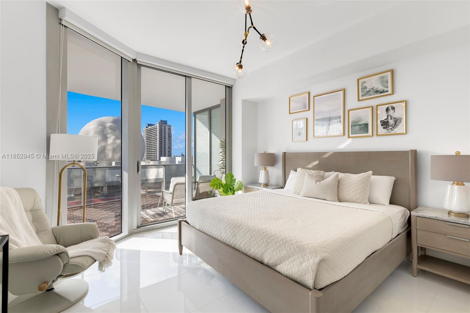 851 Northeast 1st Avenue, Unit 1010 Miami, FL 33132 - Photo 4 of 20 a bedroom with a bed and glass walk in closet