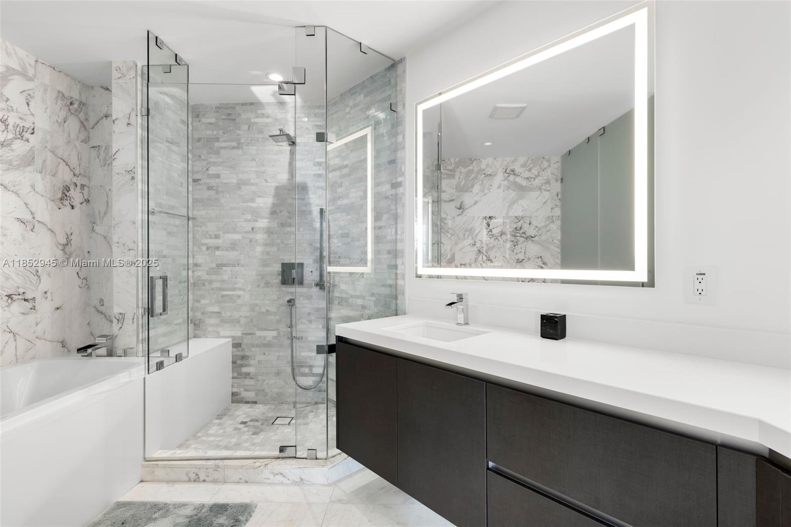 851 Northeast 1st Avenue, Unit 1010 Miami, FL 33132 - Photo 5 of 20 a bathroom with a sink and a mirror