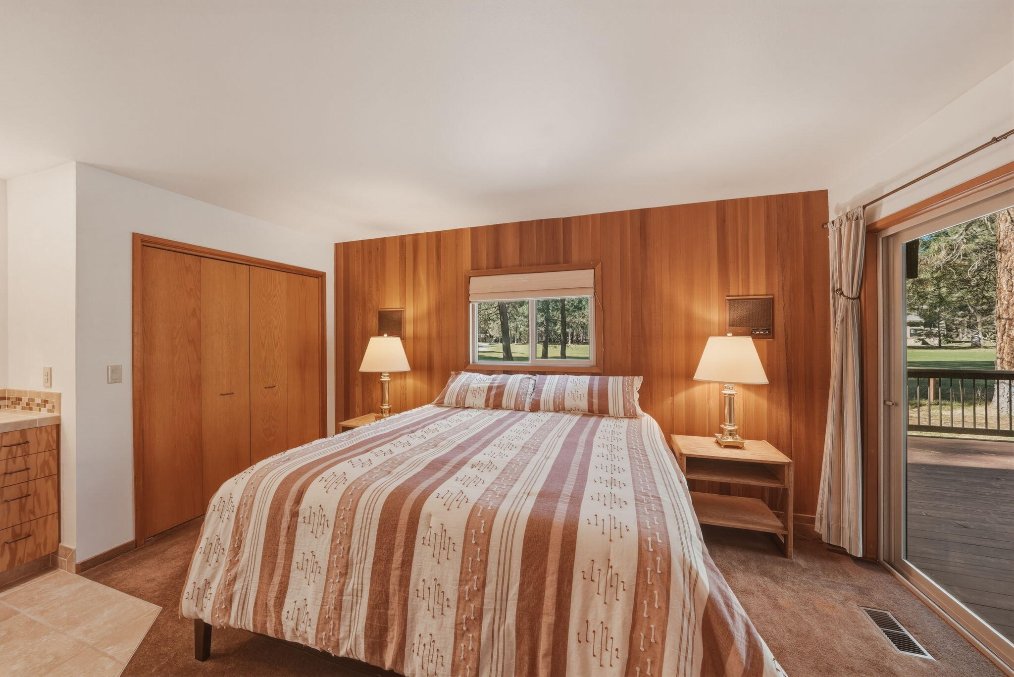 13137 Hawks Beard, Unit GH 129 Black Butte Ranch, OR 97759 - Photo 15 of 57 a bed sitting in a bedroom next to a window