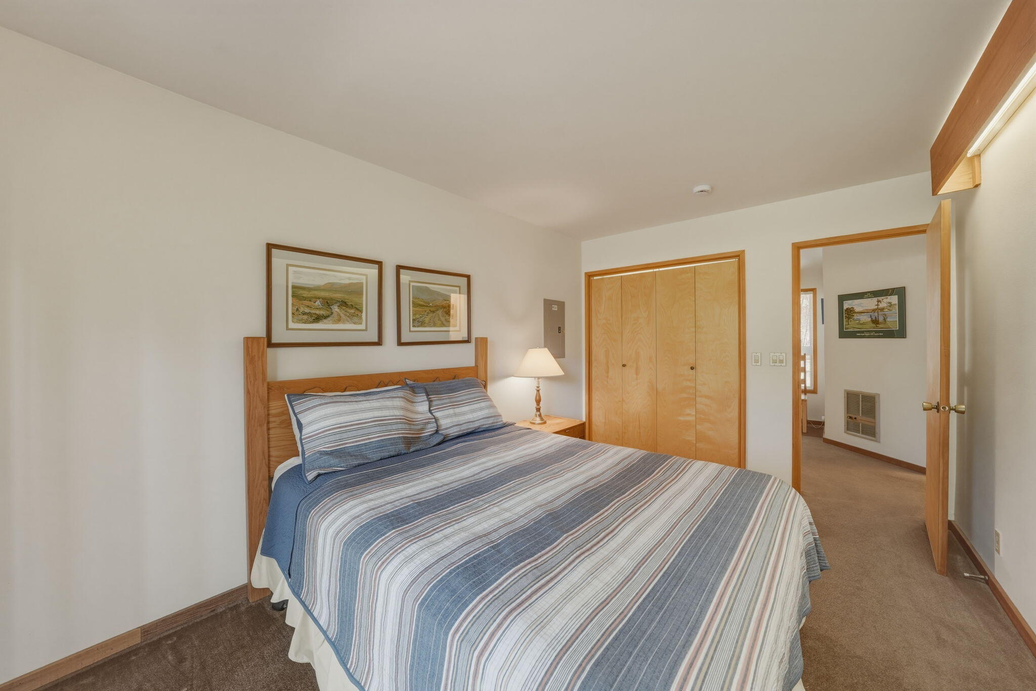 13137 Hawks Beard, Unit GH 129 Black Butte Ranch, OR 97759 - Photo 24 of 57 a bedroom with a large bed and a painting