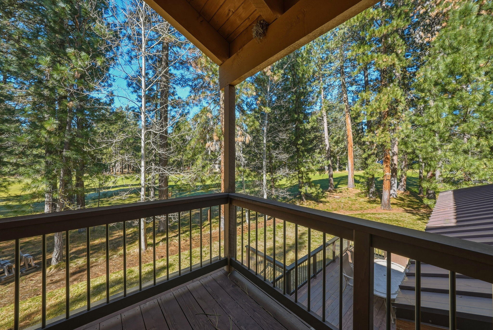 13137 Hawks Beard, Unit GH 129 Black Butte Ranch, OR 97759 - Photo 35 of 57 a view of a wooden deck next to a yard