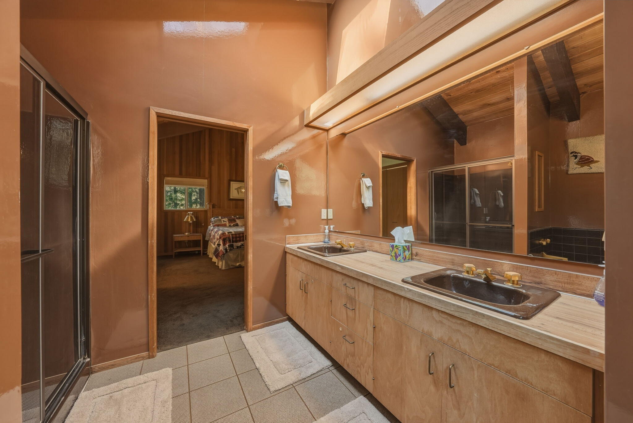 13137 Hawks Beard, Unit GH 129 Black Butte Ranch, OR 97759 - Photo 37 of 57 a spacious bathroom with a granite countertop sink and a mirror