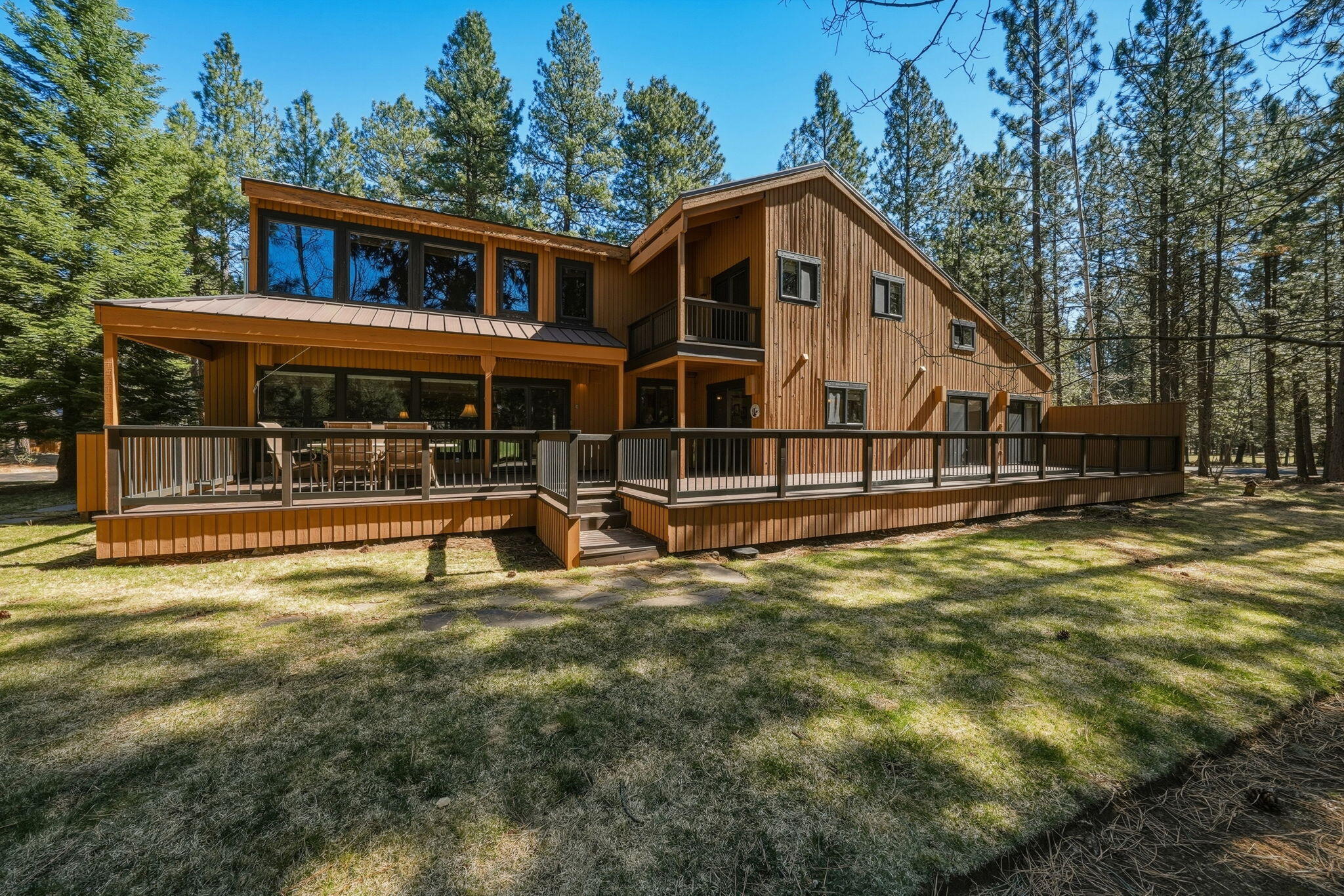 13137 Hawks Beard, Unit GH 129 Black Butte Ranch, OR 97759 - Photo 42 of 57 a view of a house with pool and chairs