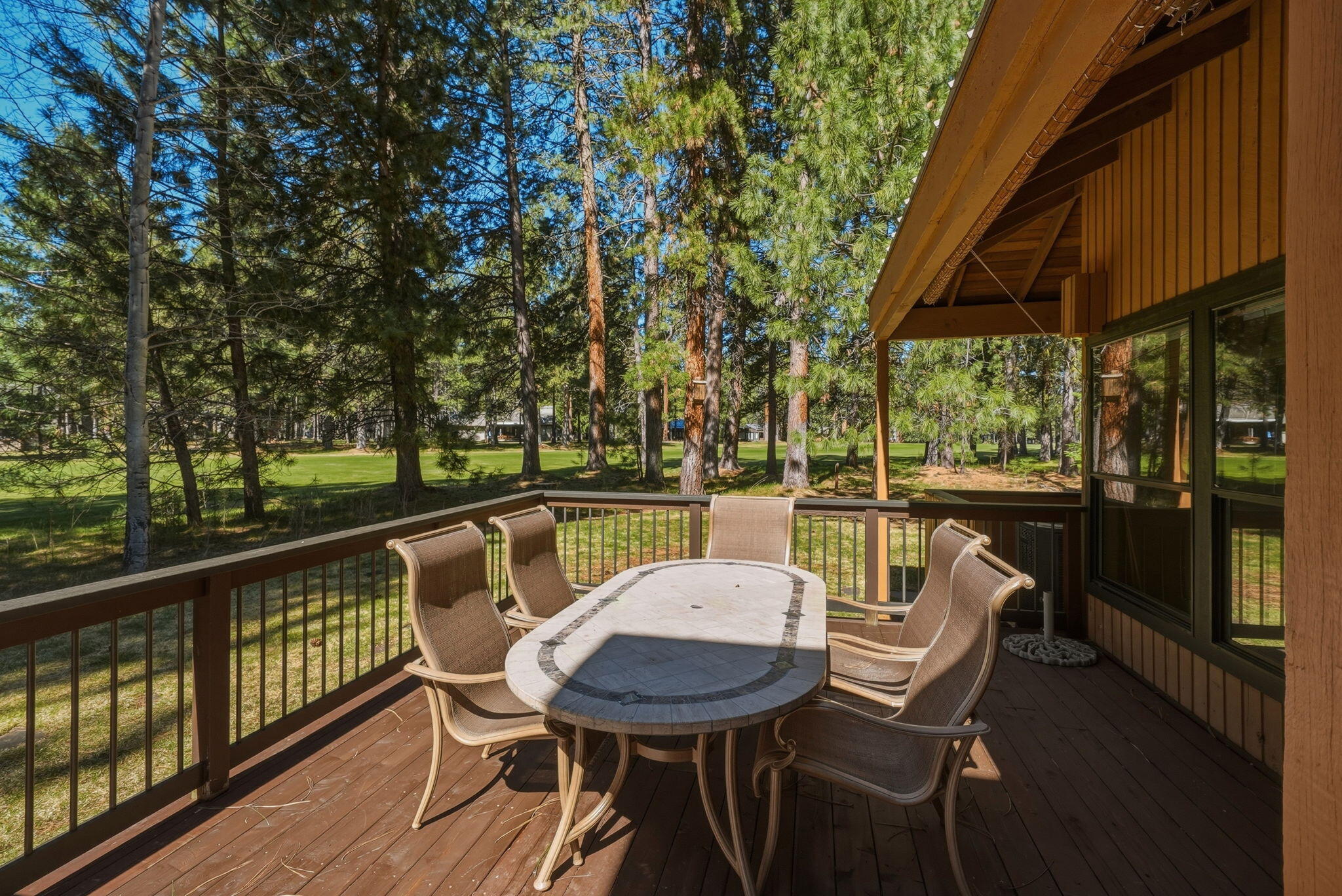 13137 Hawks Beard, Unit GH 129 Black Butte Ranch, OR 97759 - Photo 43 of 57 a view of a chairs and table in patio with a yard